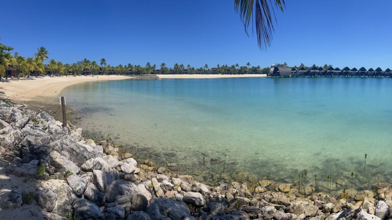 Calm lagoon and palm-lined beach at a resort in Fiji